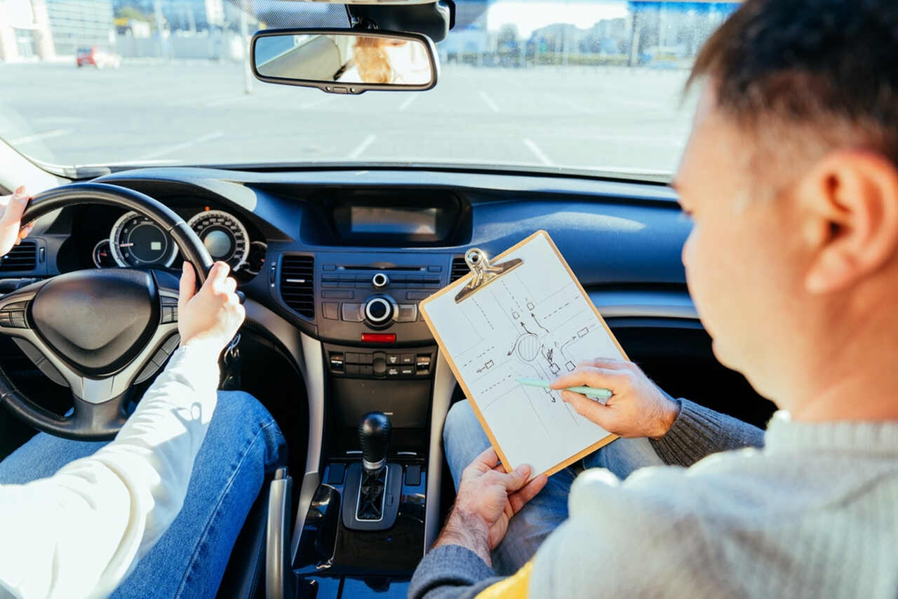 man instructor teaching student about traffic