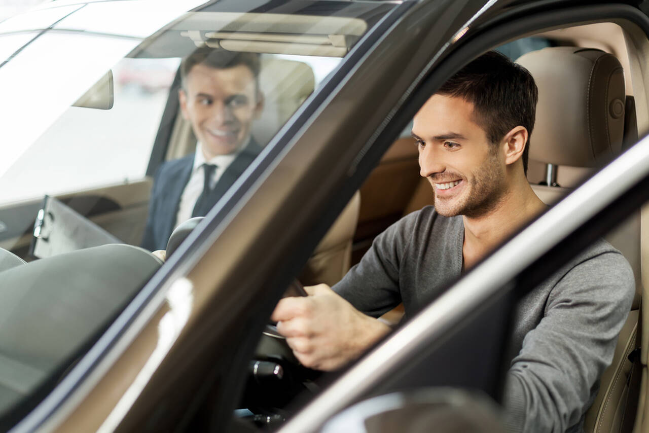 man takes his driving test with the instructor